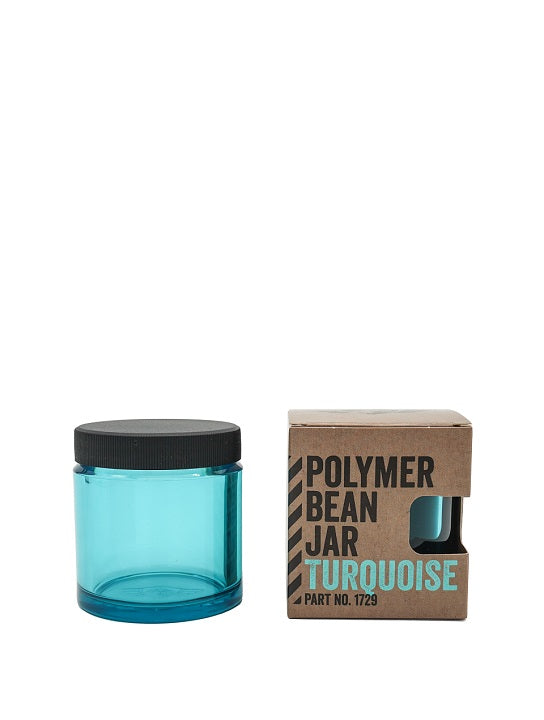 Comandante Polymer Bean Jar i turkis, komplet med et sort låg, parrer smukt med dens miljøvenlige brune æske mærket "Polymer Bean Jar Turquoise Part No. 1729", hvilket gør den til et ideelt valg for Comandante C40 fans.