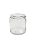 Comandante Kaffebønne Glas, Klart, har en bred åbning og kort cylindrisk form for optimal opbevaring af kaffebønner, sat mod en almindelig hvid baggrund.