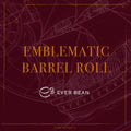 Rødbrun baggrund med en svag stregtegning af et sejlskib. I fed guldtekst står der "Limited, Emblematic Barrel Roll". Herunder det hvide EverBean Limited swirl-logo. Svage koordinater og romfade kaffe-accenter tilføjer intriger til dette elegante design.